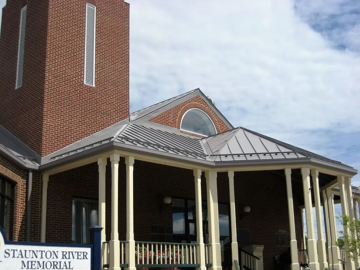 Skilled roofing craftsmen working on a residential roof in Del Haven
